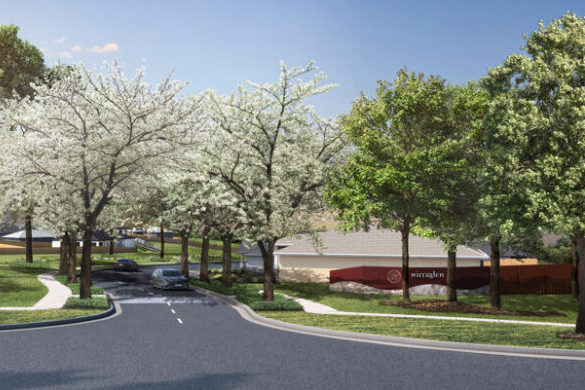 Wirraglen Entry, picturing a tree lined street and brown sign